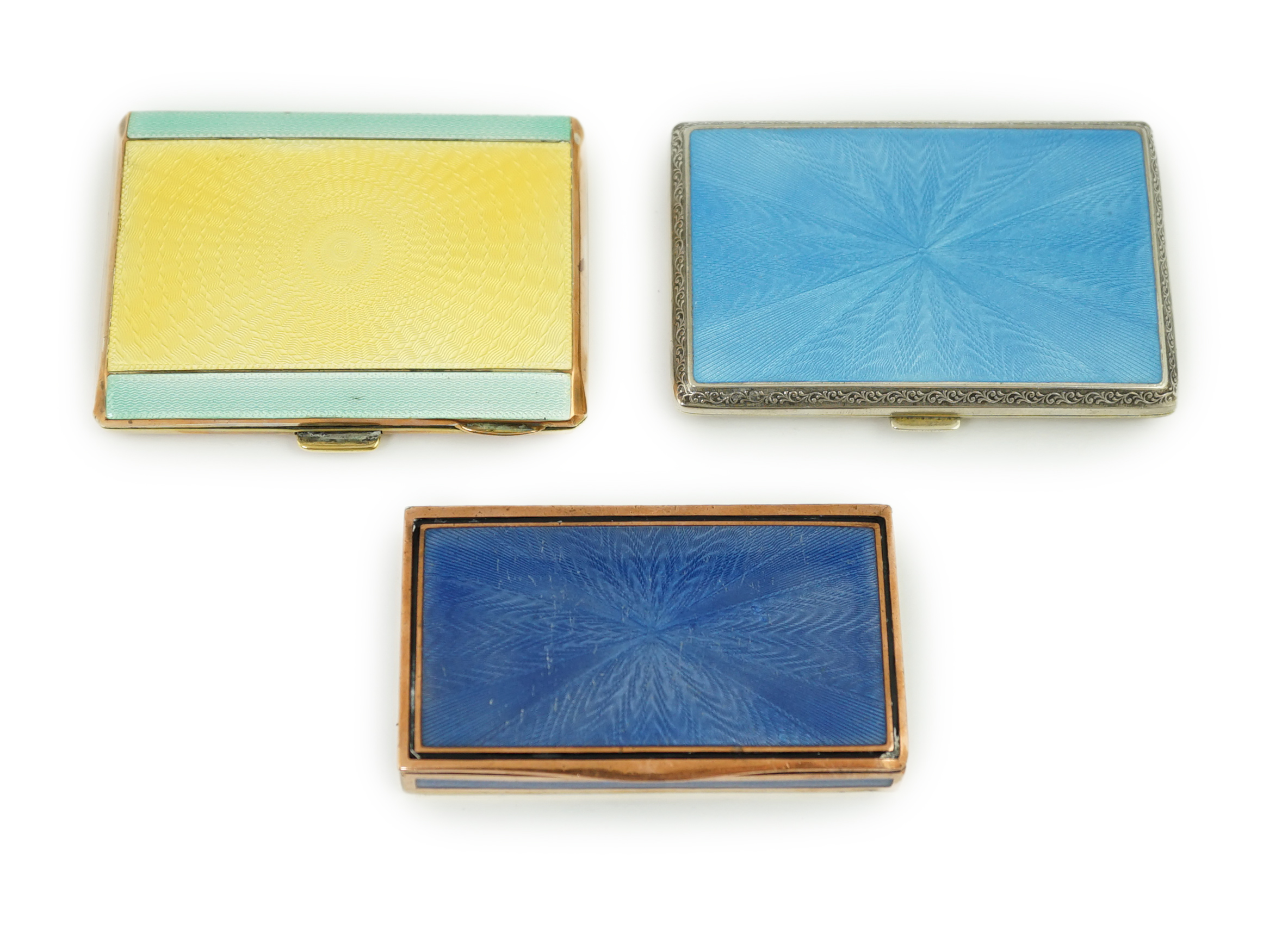 Two early 20th century enamelled white and gilt metal cigarette cases and a snuff box